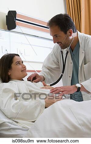 Pregnant woman and doctor View Large Photo Image Picture - Pregnant woman and doctor. Fotosearch