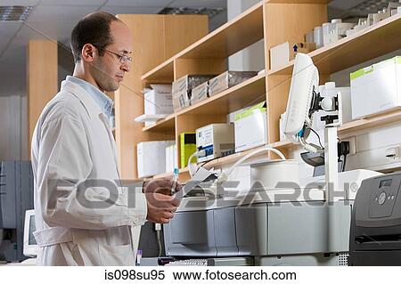 Technician in laboratory View Large Photo Image Stock Photography - Technician in laboratory. Fotosearch