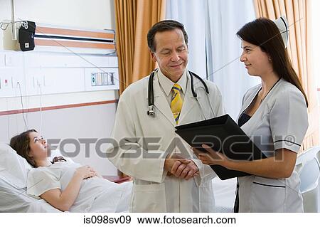 Young woman in hospital room with doctor and nurse View Large Photo Image Stock Photo - Young woman in hospital room with doctor and nurse. Fotosearch