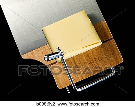 Cheese on cutting board View Large Photo Image Stock Image - Cheese on cutting board. Fotosearch