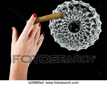 Female hand with cigar and ashtray View Large Photo Image Stock Image - Female hand with cigar and ashtray. Fotosearch