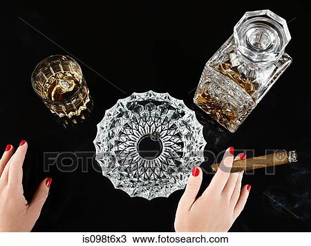 Female hand with cigar whiskey decanter View Large Photo Image Stock Image - Female hand with cigar whiskey decanter. Fotosearch