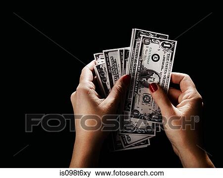 Female hand with dollar bills View Large Photo Image Stock Photo - Female hand with dollar bills. Fotosearch