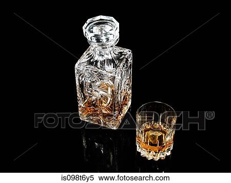 Whiskey in glass and decanter View Large Photo Image Stock Photography - Whiskey in glass and decanter. Fotosearch