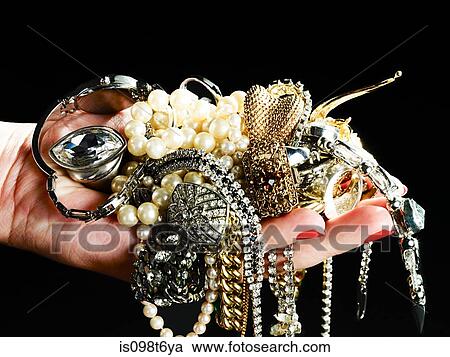 Woman holding jewelry View Large Photo Image Stock Image - Woman holding jewelry. Fotosearch