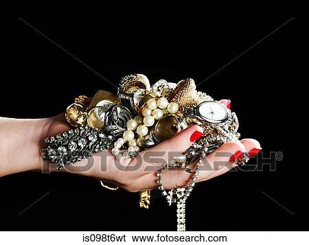 Woman holding jewelry View Large Photo Image Stock Photograph - Woman holding jewelry. Fotosearch