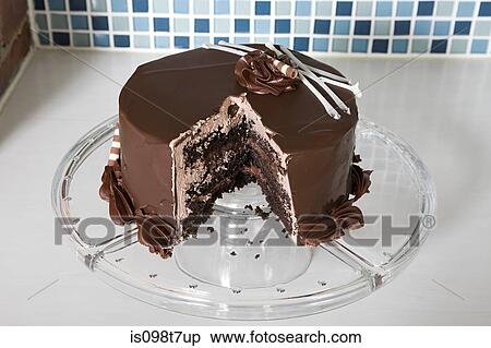 Stock Photography - Chocolate cake with missing slice. Fotosearch