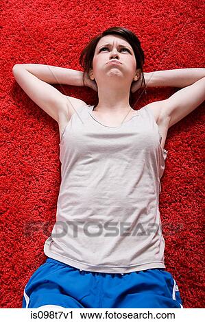 Young woman doing sit-ups View Large Photo Image Stock Image - Young woman doing sit-ups. Fotosearch