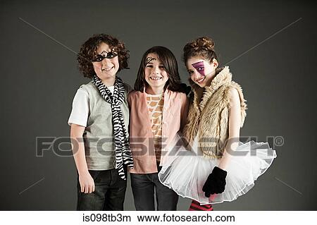 Three young friends dressed up View Large Photo Image Picture - Three young friends dressed up. Fotosearch
