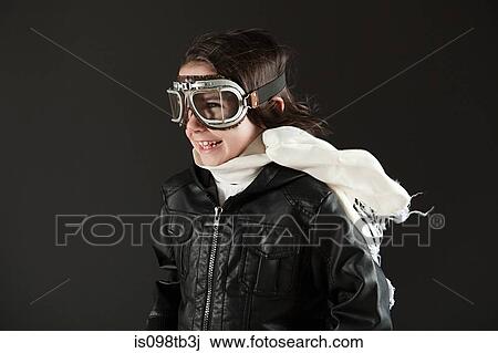 Young boy wearing flying goggles, dressed as pilot View Large Photo Image Stock Image - Young boy wearing flying goggles, dressed as pilot. Fotosearch