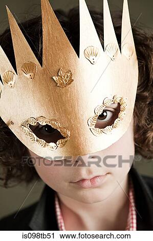 Young boy wearing gold crown mask View Large Photo Image Stock Image - Young boy wearing gold crown mask. Fotosearch