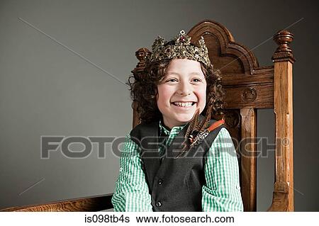 Young boy wearing gold crown View Large Photo Image Stock Photograph - Young boy wearing gold crown. Fotosearch