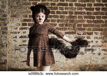 Stock Image - Young girl dressed up as cat. Fotosearch