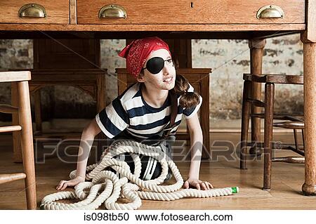 Young girl dressed up as pirate, under desk View Large Photo Image Stock Image - Young girl dressed up as pirate, under desk. Fotosearch