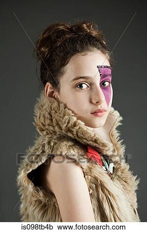 Young girl wearing purple face paint View Large Photo Image Stock Image - Young girl wearing purple face paint. Fotosearch