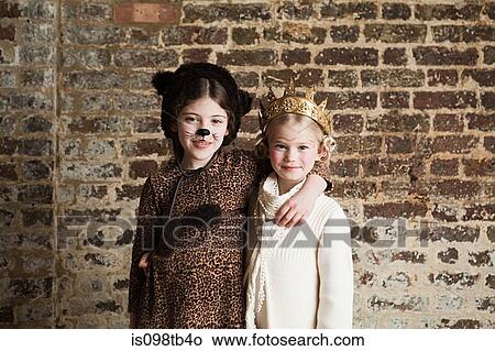 Young girls dressed up as cat and queen View Large Photo Image Picture - Young girls dressed up as cat and queen. Fotosearch
