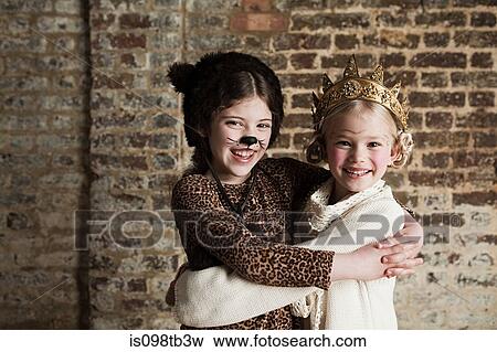 Young girls dressed up as cat and queen View Large Photo Image Stock Photo - Young girls dressed up as cat and queen. Fotosearch