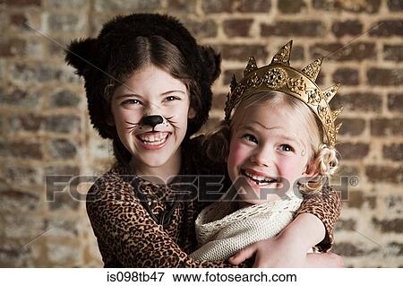 Stock Photo - Young girls dressed up as cat and queen. Fotosearch