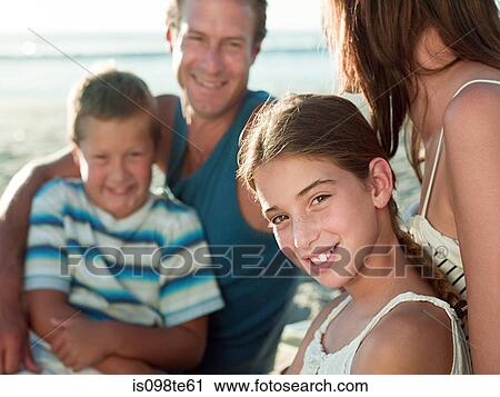 Stock Image - Family at the coast. Fotosearch