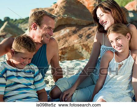 Stock Photo - Family at the coast. Fotosearch