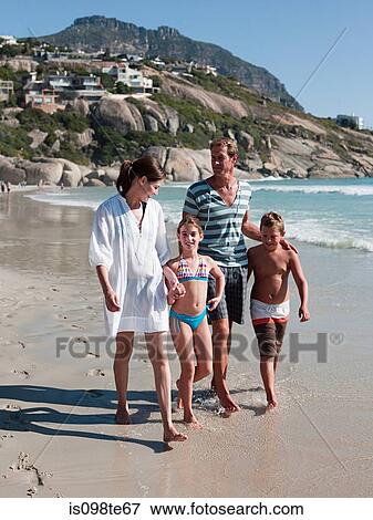 Family walking on beach View Large Photo Image Stock Photo - Family walking on beach. Fotosearch