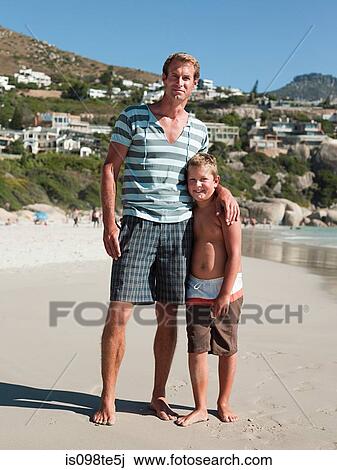 Father and son on a beach View Large Photo Image Stock Image - Father and son on a beach. Fotosearch