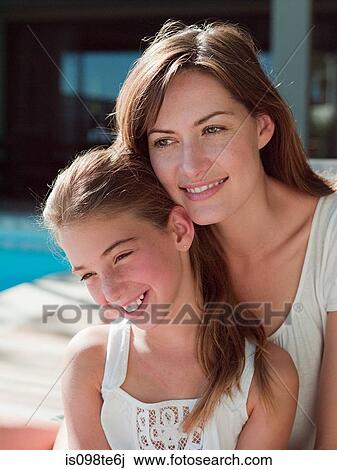 Mother and daughter outdoors View Large Photo Image Stock Image - Mother and daughter outdoors. Fotosearch