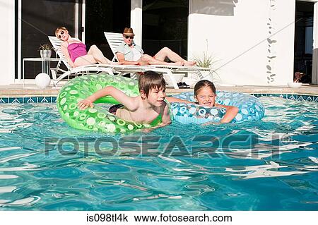 Family and outdoor swimming pool View Large Photo Image Stock Image - Family and outdoor swimming pool. Fotosearch