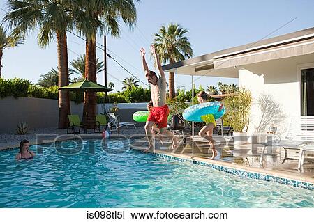Family and outdoor swimming pool View Large Photo Image Stock Image - Family and outdoor swimming pool. Fotosearch