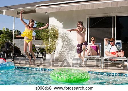 Family and outdoor swimming pool View Large Photo Image Stock Photo - Family and outdoor swimming pool. Fotosearch