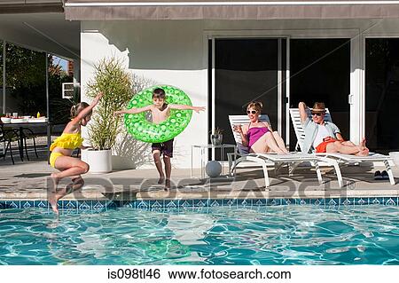 Family and outdoor swimming pool View Large Photo Image Stock Photograph - Family and outdoor swimming pool. Fotosearch