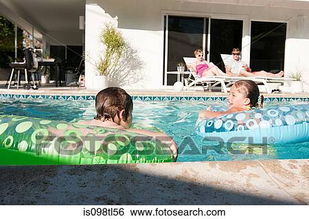 Family and outdoor swimming pool View Large Photo Image Stock Photograph - Family and outdoor swimming pool. Fotosearch