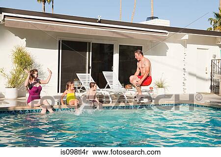Stock Photography - Family and outdoor swimming pool. Fotosearch