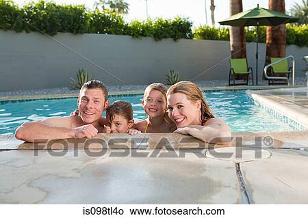 Family in outdoor swimming pool, portrait View Large Photo Image Picture - Family in outdoor swimming pool, portrait. Fotosearch