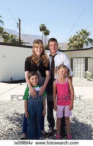 Family standing outdoors, portrait View Large Photo Image Stock Photo - Family standing outdoors, portrait. Fotosearch