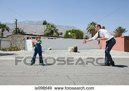 Father playing ball with son View Large Photo Image Stock Photo - Father playing ball with son. Fotosearch
