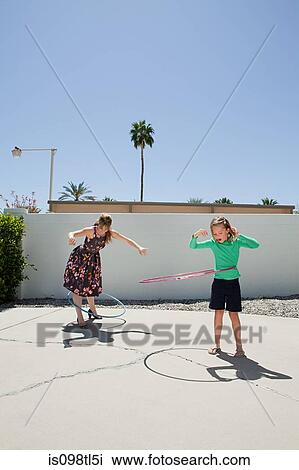 Mother and daughter with hoola hoops View Large Photo Image Stock Image - Mother and daughter with hoola hoops. Fotosearch