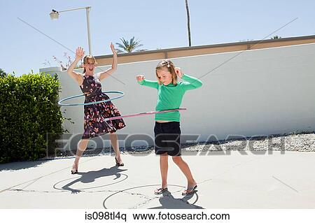 Mother and daughter with hoola hoops View Large Photo Image Stock Photography - Mother and daughter with hoola hoops. Fotosearch