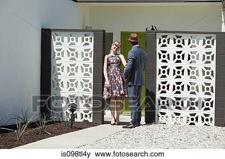Retro couple outside home View Large Photo Image Stock Photo - Retro couple outside home. Fotosearch