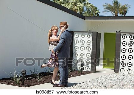 Retro couple outside home View Large Photo Image Stock Photo - Retro couple outside home. Fotosearch