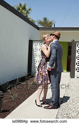 Retro couple outside home View Large Photo Image Stock Photography - Retro couple outside home. Fotosearch