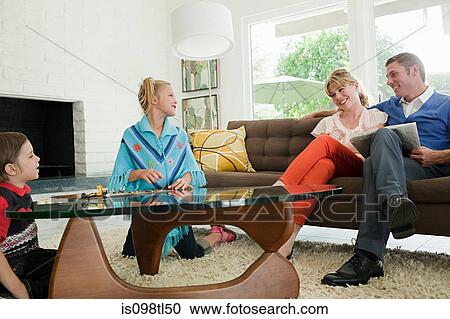 Stock Image - Retro family indoors. Fotosearch