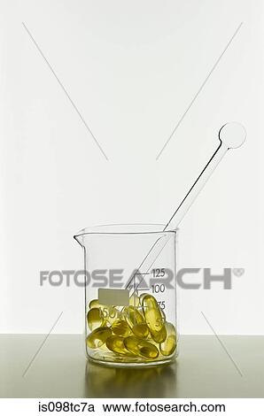 Capsules in beaker View Large Photo Image Stock Image - Capsules in beaker. Fotosearch