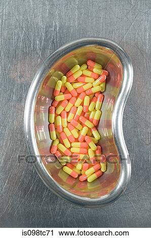 Capsules in kidney dish View Large Photo Image Stock Image - Capsules in kidney dish. Fotosearch