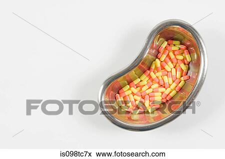 Capsules in kidney dish View Large Photo Image Stock Photo - Capsules in kidney dish. Fotosearch