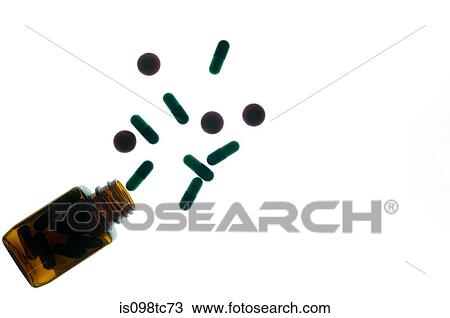 Stock Image - Medicine bottle and capsules. Fotosearch