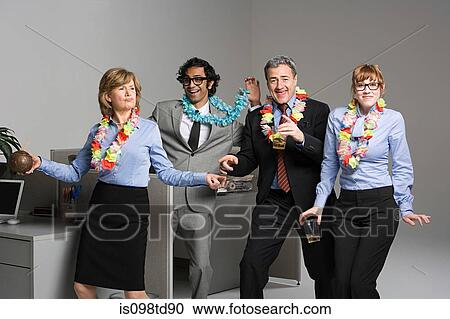 Stock Image - Business people enjoying office party. Fotosearch