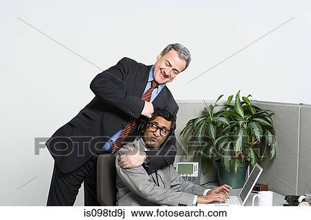 Businessman in headlock View Large Photo Image Stock Image - Businessman in headlock. Fotosearch