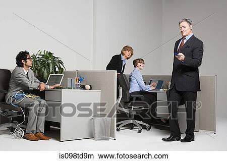 Businessman listening to MP3 player View Large Photo Image Picture - Businessman listening to MP3 player. Fotosearch