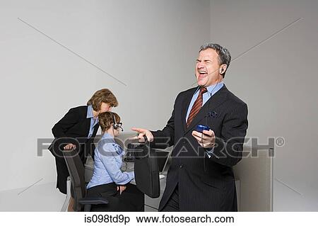 Businessman listening to MP3 player View Large Photo Image Stock Photography - Businessman listening to MP3 player. Fotosearch